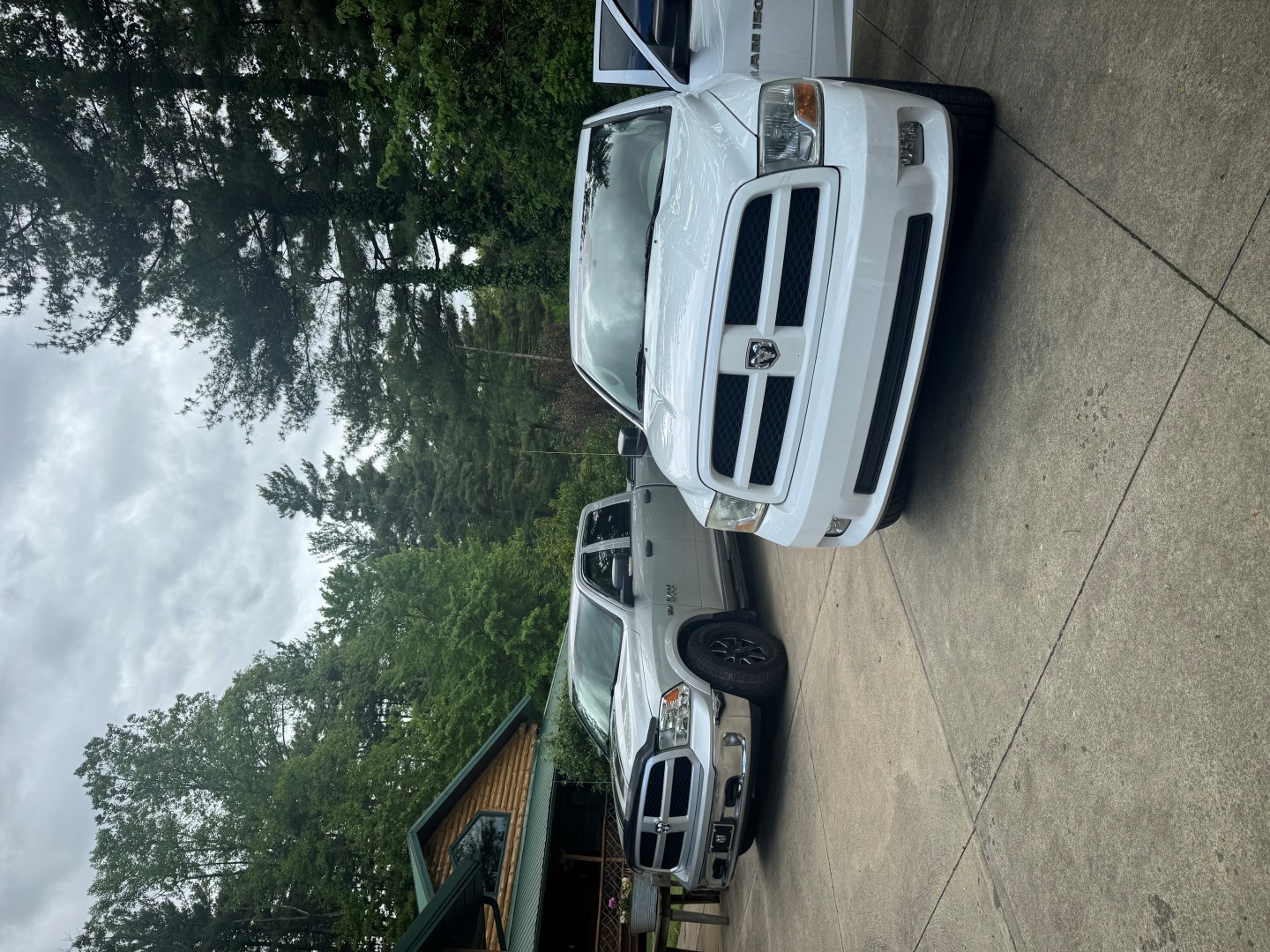 two clean trucks in a driveway